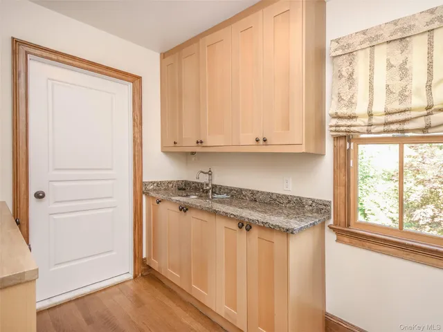 a view of cabinets with wooden floor