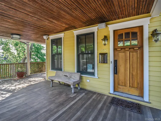 a view of a room with wooden floor and outdoor space