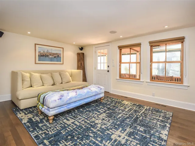 a living room with furniture and a rug