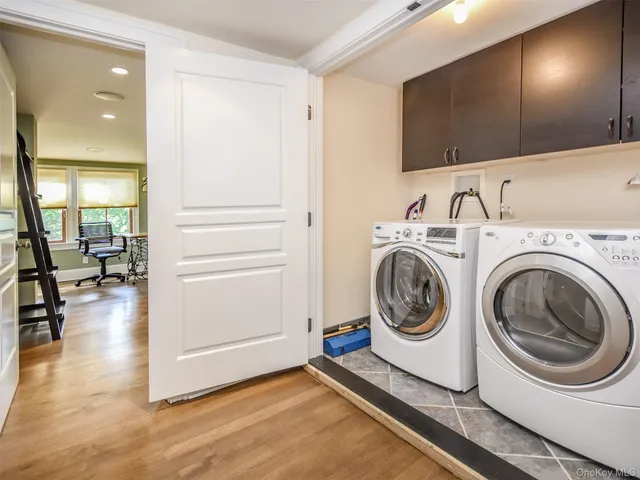 a utility room with sink dryer and washer