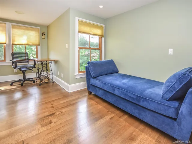 a living room with hard wood floors and a couch
