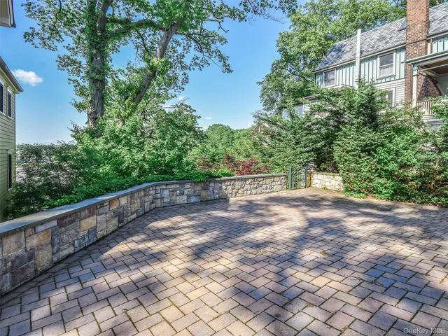 a view of street with deck and a yard