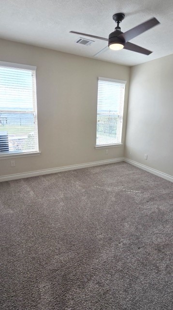 127 Bridgewater Onalaska, TX 77360 - Photo 20 of 34 an empty room with a window and a ceiling fan