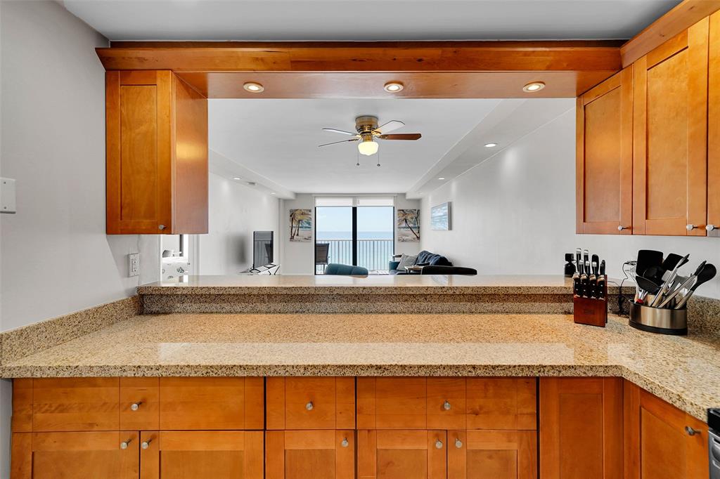 400 North Surf Road, Unit 703 Hollywood, FL 33019 - Photo 21 of 50 a view of a kitchen with a sink and cabinets