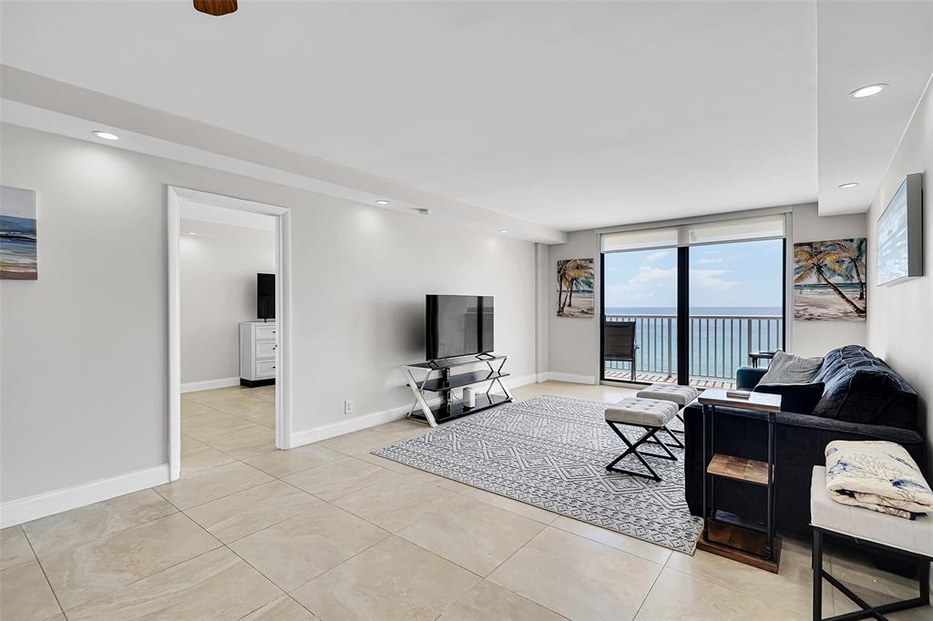 400 North Surf Road, Unit 703 Hollywood, FL 33019 - Photo 31 of 50 a living room with furniture and a flat screen tv