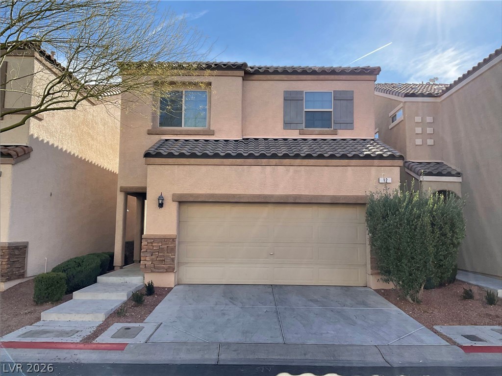 12 Jasmine Point Street Henderson, NV 89074 - Photo 1 of 15 A desert oasis with charming stucco exterior, inviting entryway, and convenient attached garage.