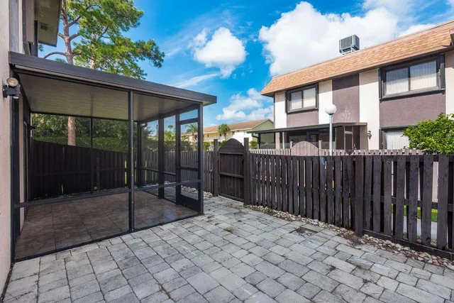 a balcony view with a backyard space