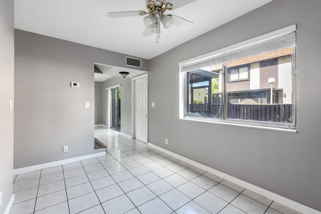 a view of an entryway with wooden floor and chandelier