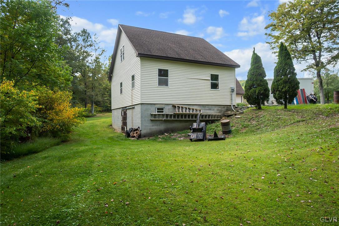115 Pine Cove Court Lehighton, PA 18235 - Photo 16 of 49 a view of a house with a yard and sitting area