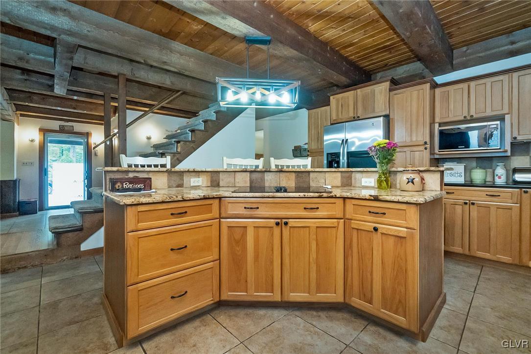 115 Pine Cove Court Lehighton, PA 18235 - Photo 32 of 49 a kitchen with granite countertop a sink and cabinets