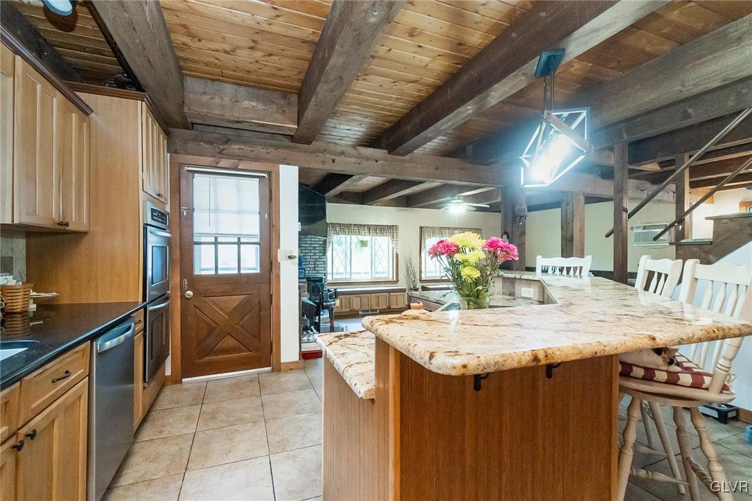 115 Pine Cove Court Lehighton, PA 18235 - Photo 34 of 49 a kitchen with a sink a counter top space and stainless steel appliances