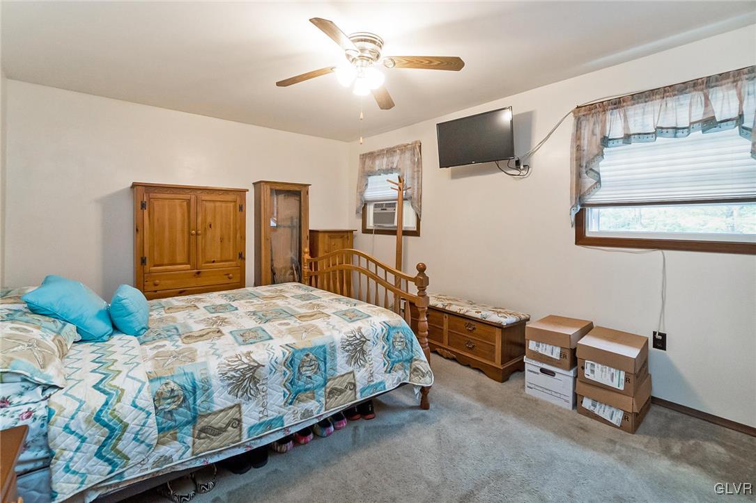 115 Pine Cove Court Lehighton, PA 18235 - Photo 40 of 49 a bedroom with a bed and a dresser