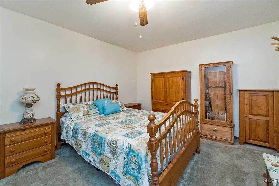 115 Pine Cove Court Lehighton, PA 18235 - Photo 41 of 49 a bedroom with a bed and a baby crib