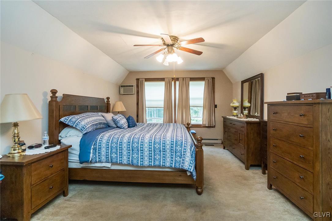 115 Pine Cove Court Lehighton, PA 18235 - Photo 43 of 49 a bedroom with a bed and wooden floors