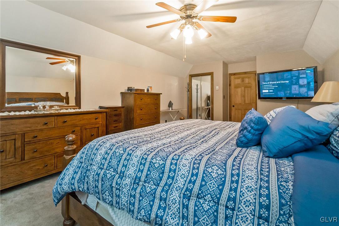 115 Pine Cove Court Lehighton, PA 18235 - Photo 45 of 49 a bedroom with a bed and a mirror on the dresser