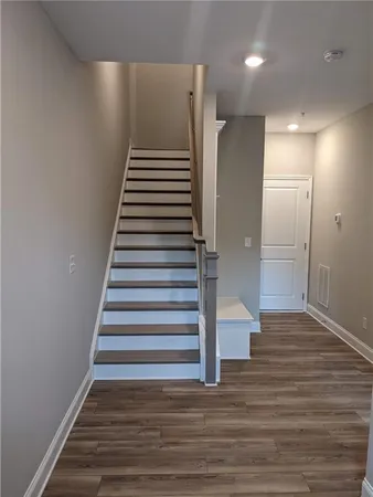 a view of entryway with wooden floor
