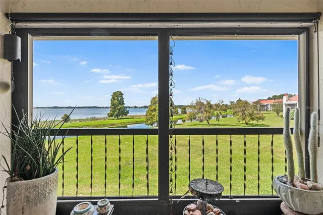 a view of a back yard from a balcony