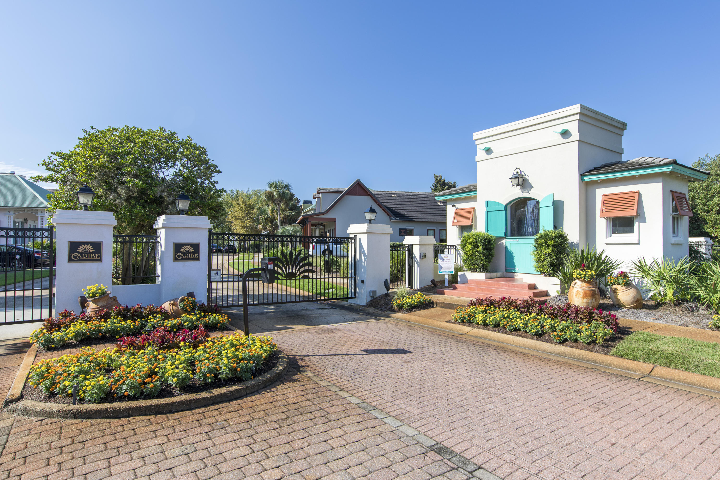 233 Rue Martine Miramar Beach, FL 32550 - Photo 1 of 1 a front view of a house with a yard and potted plants