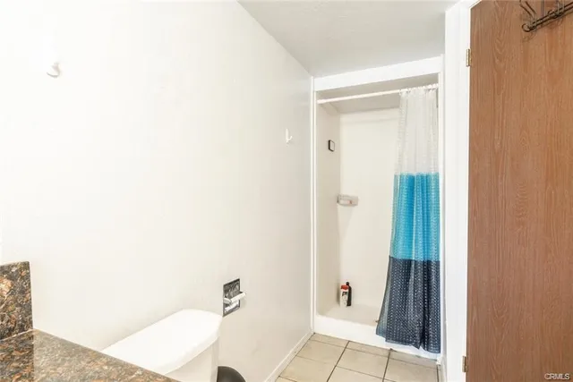a bathroom with a tub and shower