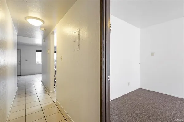 a view of an empty room and bathroom