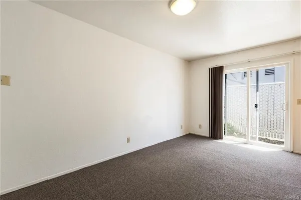 a view of an empty room with a birdcage