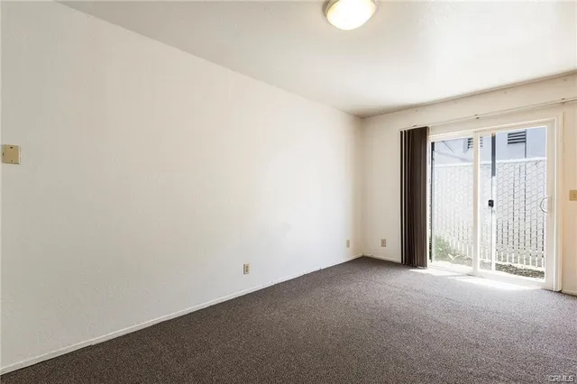 a view of an empty room with a birdcage
