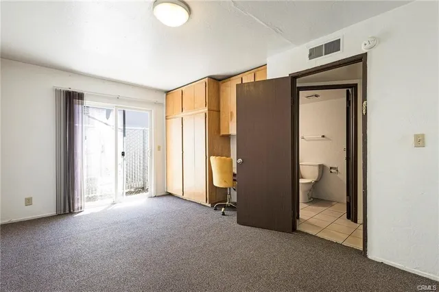 an empty room with a hallway