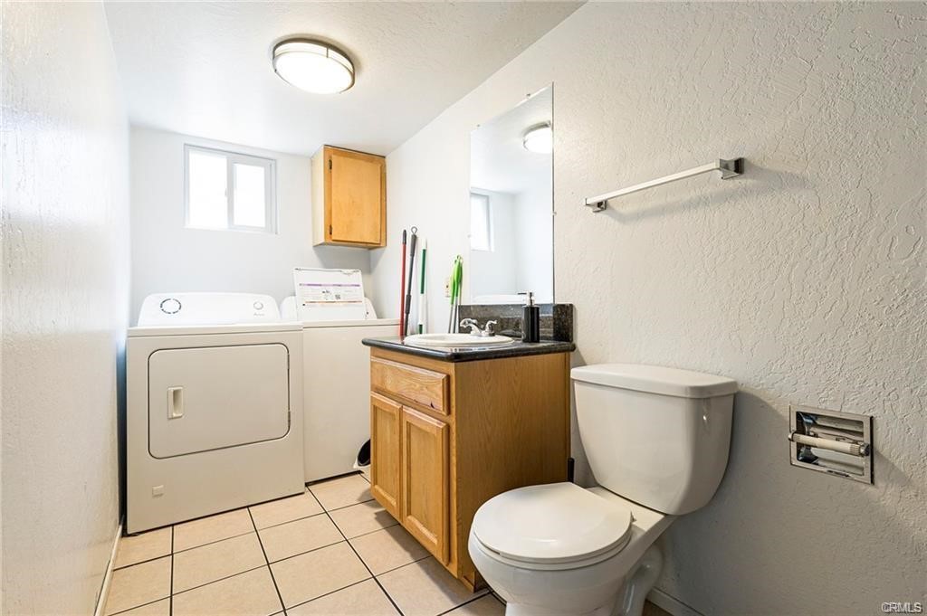609 Rancheria Drive Chico, CA 95926 - Photo 35 of 60 a bathroom with a toilet sink and mirror