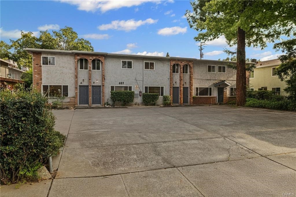 609 Rancheria Drive Chico, CA 95926 - Photo 4 of 60 a front view of a building with a garden