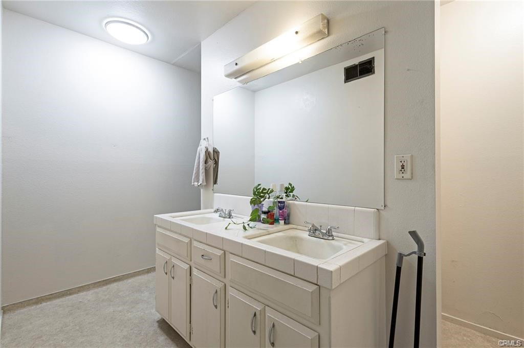 609 Rancheria Drive Chico, CA 95926 - Photo 54 of 60 a bathroom with a sink and a mirror