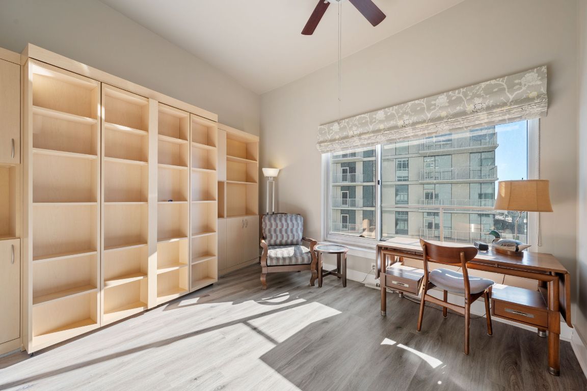 603 Davis Street, Unit 2009 Austin, TX 78701 - Photo 23 of 37 a dining room with furniture and wooden floor