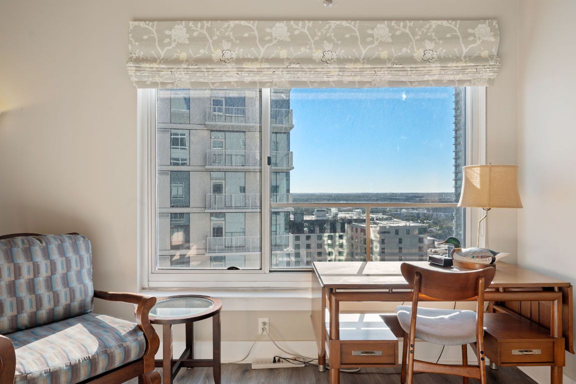 603 Davis Street, Unit 2009 Austin, TX 78701 - Photo 25 of 37 a living room with furniture and a floor to ceiling window