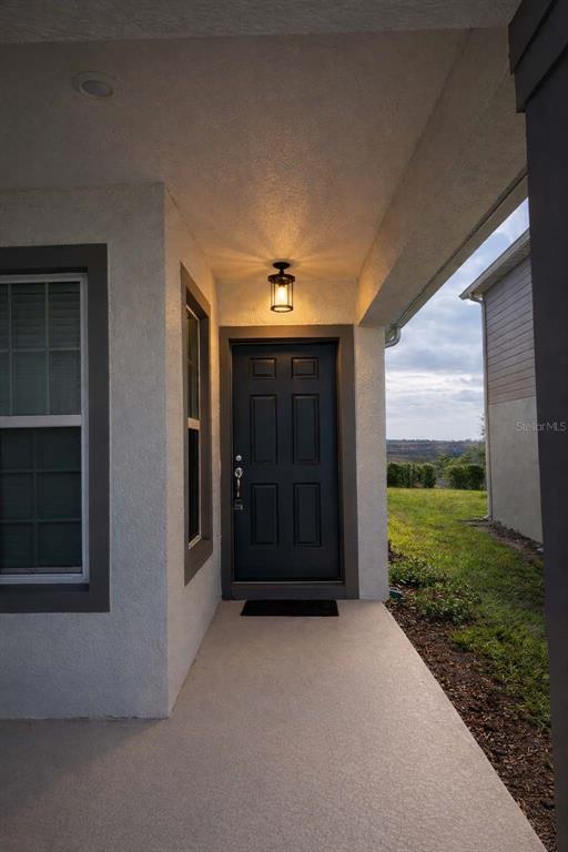 7363 Catania Loop Clermont, FL 34714 - Photo 2 of 12 a view of a porch