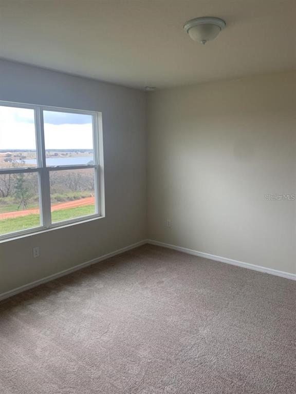 7363 Catania Loop Clermont, FL 34714 - Photo 9 of 12 an empty room with a window