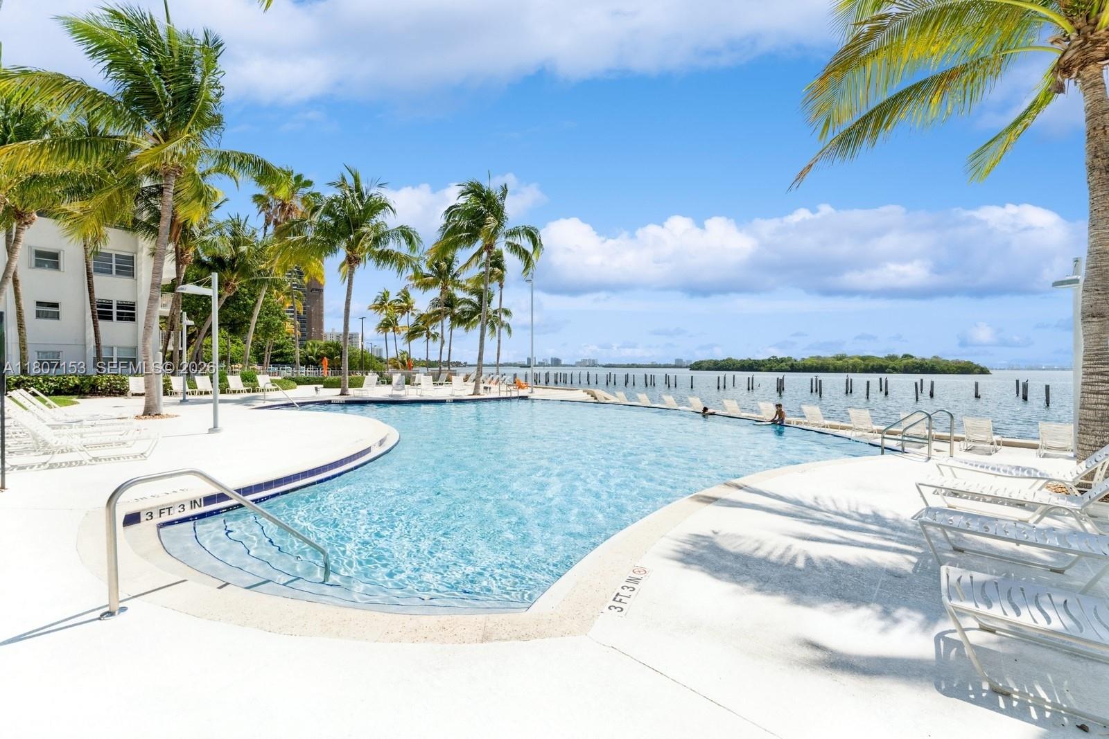750 Northeast 64th Street, Unit B308 Miami, FL 33138 - Photo 12 of 25 a view of a swimming pool with a terrace