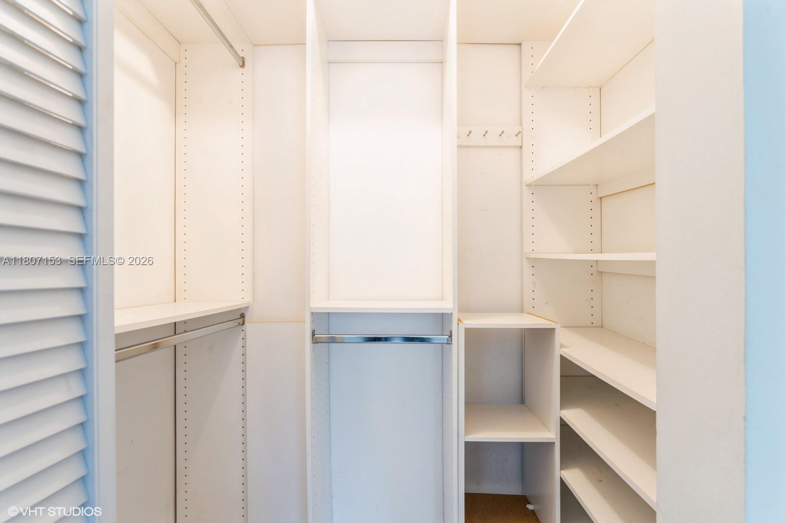 750 Northeast 64th Street, Unit B308 Miami, FL 33138 - Photo 23 of 25 a view of an empty walk in closet