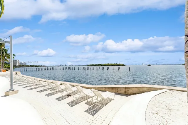 a view of swimming pool with outdoor seating