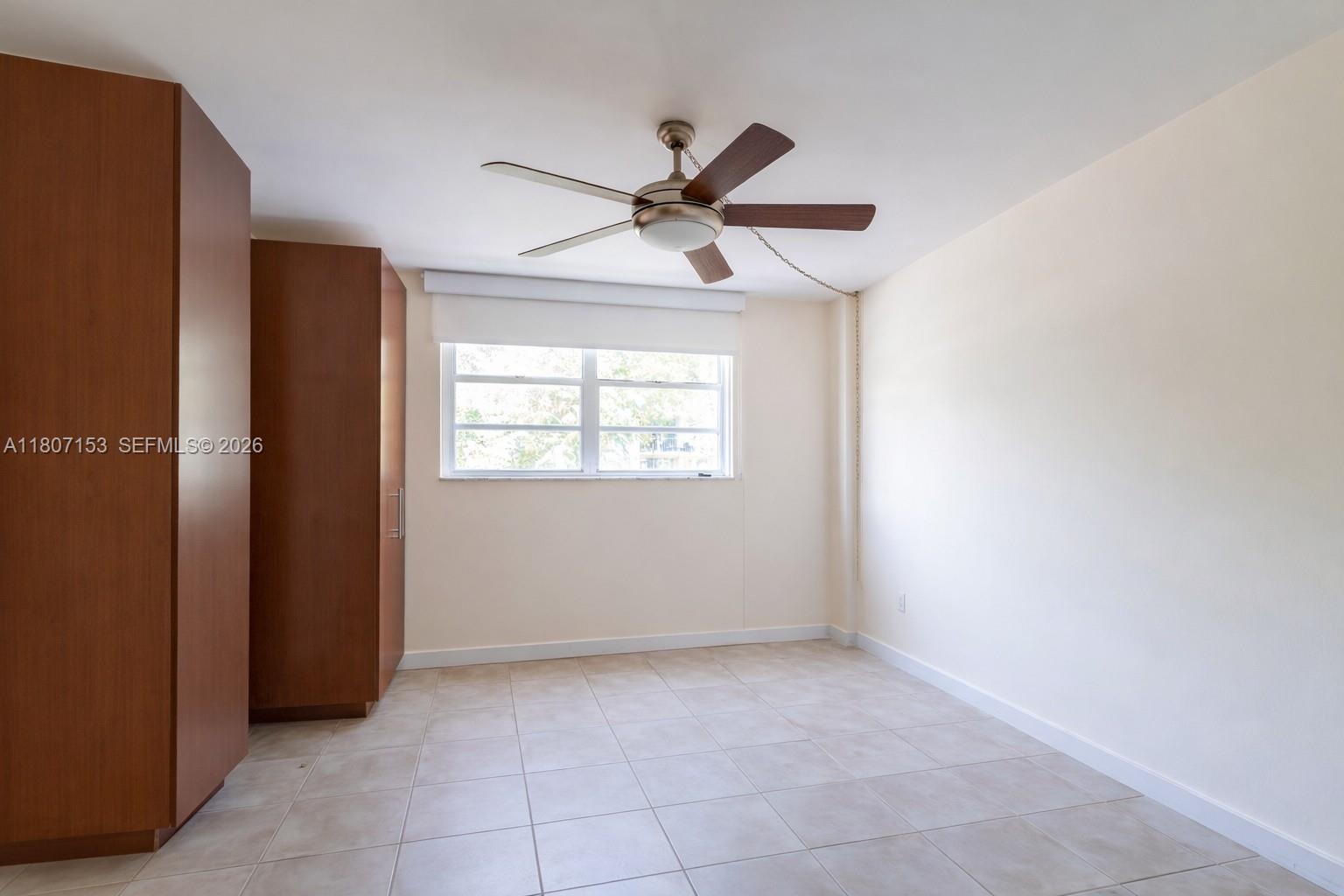 750 Northeast 64th Street, Unit B308 Miami, FL 33138 - Photo 7 of 25 a view of an empty room with a window