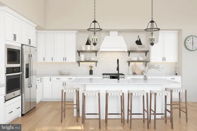 a kitchen with stainless steel appliances granite countertop a sink and a refrigerator