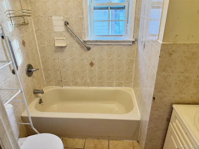 a bathroom with a sink a toilet and a bathtub