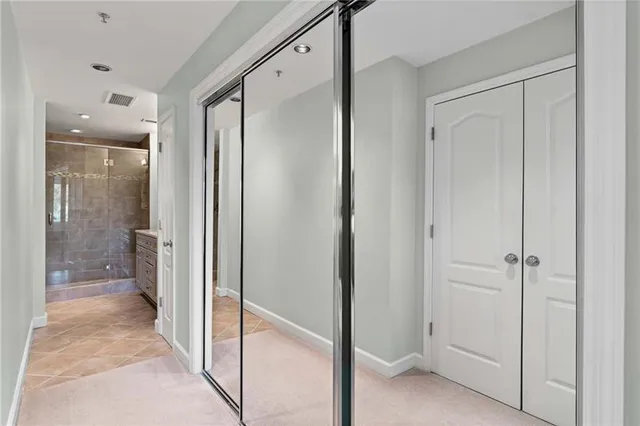 a view of a bathroom with a glass shower door