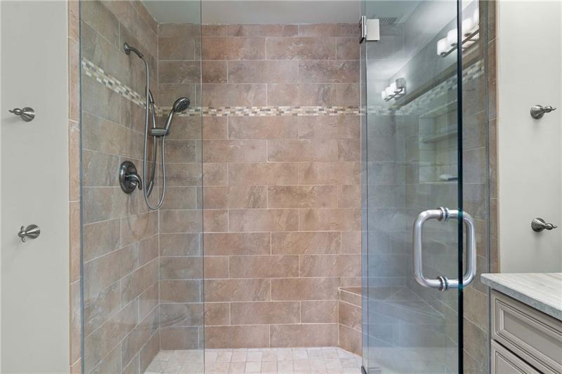 3475 Oak Valley Road Northeast, Unit 470 Atlanta, GA 30326 - Photo 17 of 34 a bathroom with a shower