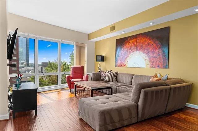 a living room with furniture and a large window