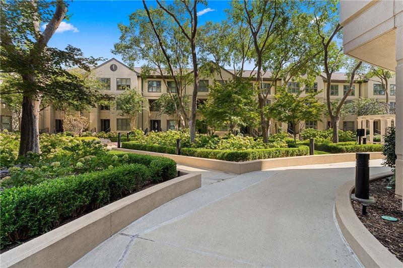 3475 Oak Valley Road Northeast, Unit 470 Atlanta, GA 30326 - Photo 25 of 34 a view of a garden with tall buildings