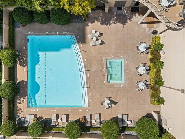 an aerial view of a house with a yard and plants