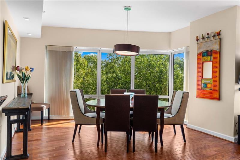 3475 Oak Valley Road Northeast, Unit 470 Atlanta, GA 30326 - Photo 4 of 34 a dining room with furniture window wooden floor