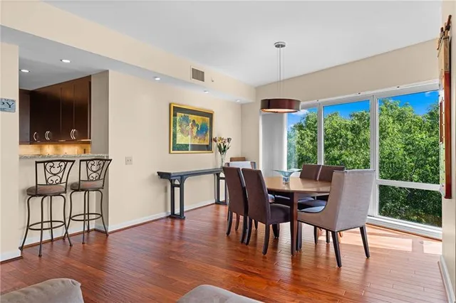 a view of a dining room with furniture window and wooden floor