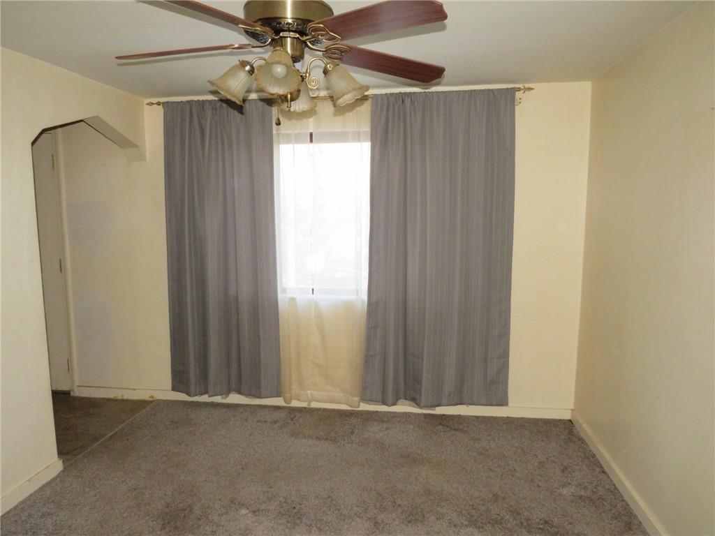 1252 Brinton Road Pittsburgh, PA 15221 - Photo 18 of 35 an empty room with windows and fan