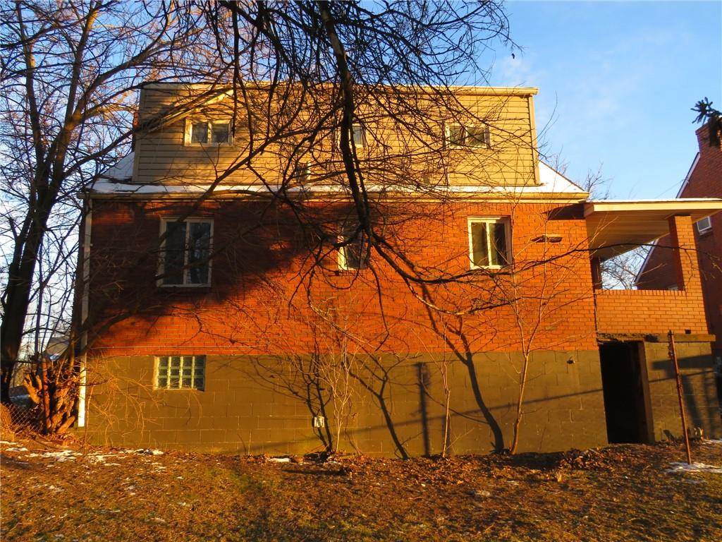 1252 Brinton Road Pittsburgh, PA 15221 - Photo 35 of 35 a view of a yard covered with snow in front of house