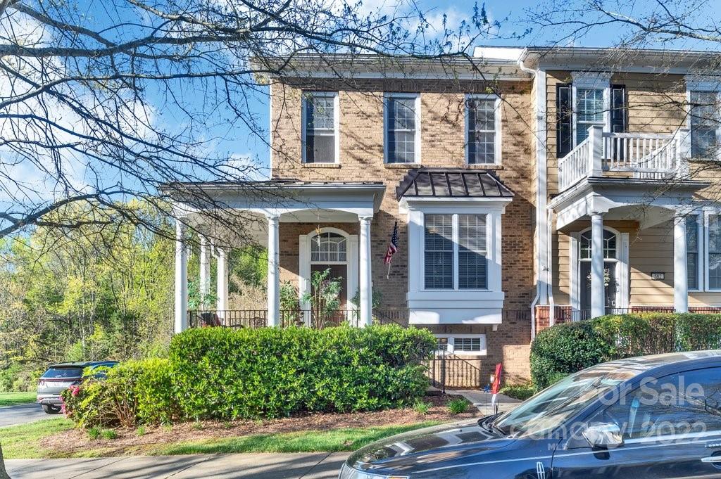 584 6th Baxter Crossing Fort Mill, SC 29708 - Photo 1 of 21 front view of a brick house with a large window